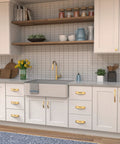 Modern kitchen with Solid Core Cabinet Pulls 10 Pack In Brushed Golden Brass Finish Dover Collection on white cabinetry