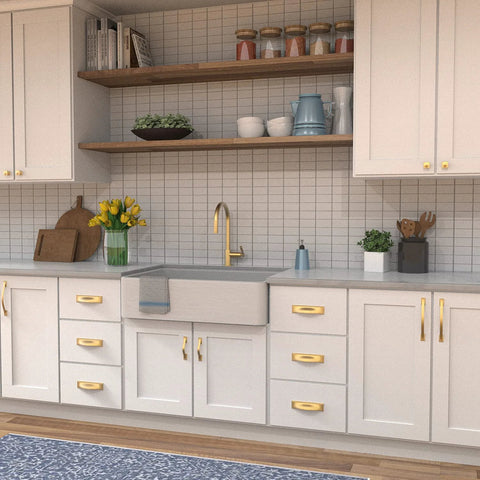 Modern kitchen with Solid Core Cabinet Pulls 10 Pack In Brushed Golden Brass Finish Dover Collection on white cabinetry