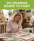 Front view of a woman artist painting on wooden boards in a bright studio with brushes and paints.
