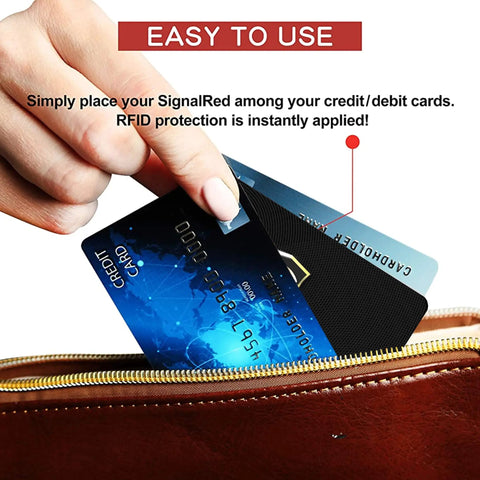 Hand placing RFID blocking card into wallet alongside credit card, part of Five Pack RFID Blocking Cards For Wallets And Purses Protect NFC Contactless Debit And Credit Cards Bank IDs And ATM Cards From E Theft And Skimming, Slim Card Blockers That Keep Your Wallet Secure Everywhere.