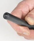 Close-up of a hand holding a tool from Steel Transfer Punch Set With Index Stand 28 Piece Pack For Machinists And Tool Cribs Sizes Range.