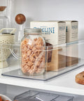 No Sweat Big League Heavy Duty Clear Stackable Extra Long Plastic Storage Bin For Nifty Pantry Setup with snacks in jar.