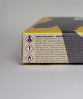 Side view of Boot And Shoe Repair Kit With Flexible Waterproof Adhesive, focusing on safety information and hazard symbols on packaging.