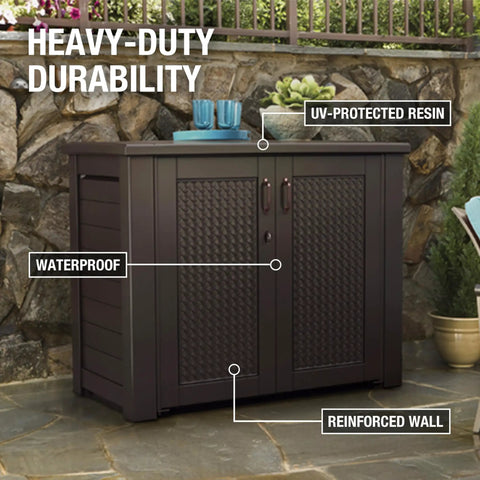 Decorative Outdoor Storage Cabinet 123 Gallon Weather Resistant Brown for patio shown with closed lid against stone wall.
