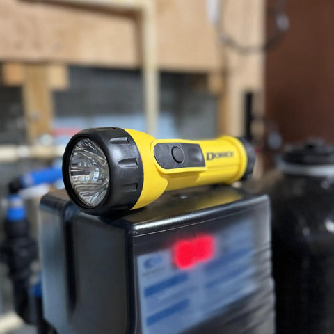 Close-up of yellow Heavy Duty Worklight Flashlight With Batteries Included For Home, Garage, And Jobsite Use 20 Lumens