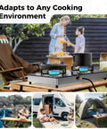 Grillin Ready Portable Double Burner Propane Stove With Auto Ignition on picnic table, camping scene in background, outdoors