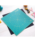 Self Healing Rotating Cutting Mat 17x17 Inches With Grid For Quilting Sewing Fabric And Crafts 360 Degree Spin shown on table
