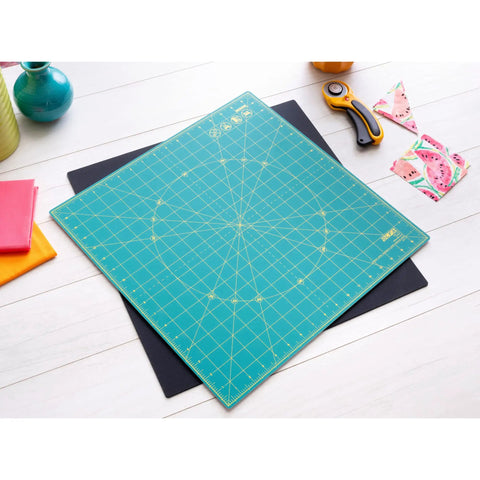 Self Healing Rotating Cutting Mat 17x17 Inches With Grid For Quilting Sewing Fabric And Crafts 360 Degree Spin shown on table