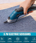 Smooth Cruising Cordless Electric Scissors 37 Volt Rechargeable Fabric Cutter cutting blue carpet with ergonomic grip.