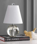 Clear Crystal Ball LED Table Lamp 16 Inches on a book, with White Linen Empire Shade, modern bedside light