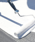 Applying Max Stretch Roof Coating White Elastomeric Sealant For Flat And Low Slope Roofs One Gallon with a paint roller.