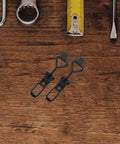 Heavy Duty Adjustable Toggle Latch Clamp With Quick Release Metal Pull Latch, black iron, shown on wooden surface with tools.
