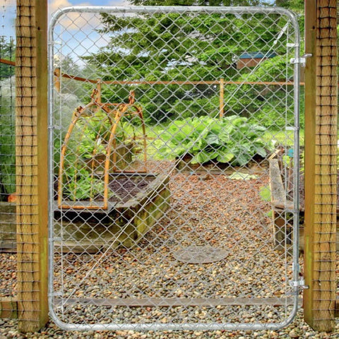 Adjustable Gate Kit For Chain Link Fence With Round Frame That Fits 24-72 Inch Openings And Up To 12 Feet installed in garden