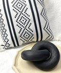 Two Link Wood Chain Decor Hand Carved Boho Farmhouse Style, black pine wood ring on decorative tray, patterned pillow background.