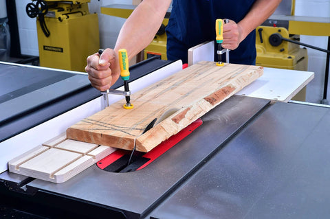 Person using Matchfit Dovetail Clamps Four Pack Exclusive Bundle With Dovetail Router Bit One Quarter Inch Shank on a wood board