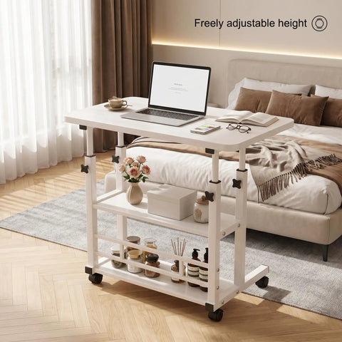 Height Adjustable Standing Desk With Rock Solid Swivel Casters And Sturdy Mobile Computer Workstation beside bed for easy access.
