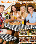 Group enjoying a meal with Six Foot Picnic Table Cover With Bench Covers Set All Weather Dual Layer Waterproof Tablecloth With Windproof Elastic Edging Includes Drawstring Bag Washable RV Camping Accessories 72x30 Inch Table Cover And 72x12 Inch Bench Covers Black Checkered