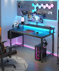 40 Inch Black Gaming Desk With LED Lights And Built In Power Outlets USB Ports Monitor Stand And Charging Station For Home Office Teen Study And Gaming Setup