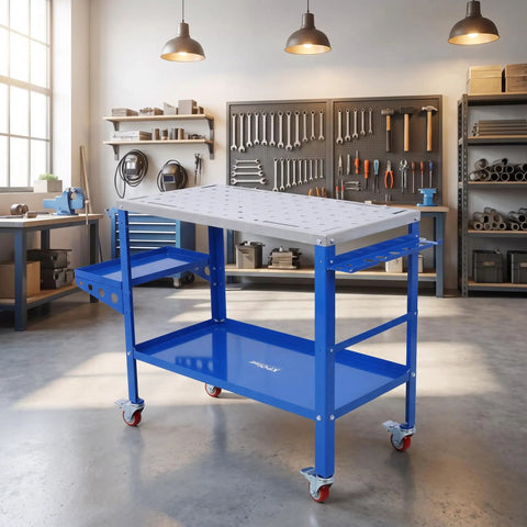 Heavy Duty Steel Welding Table With Adjustable Height And Three Angle Tilting Featuring Lockable Caster Wheels Tool Storage Trays And Built Tough Frames For Hardcore Shop Fabrication in a workshop.