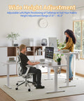Kickstart Your Home Office Upgrades With Killer Electric L Shaped Standing Desk 63 By 55 Inches Height Adjustable Corner Workstation Reversible Setup White Finish Smooth Motor Operation Ultimate Workspace Boost. Image showing height adjustable desk with user working at it.