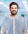 Man wearing 10 Pack White Disposable Lab Coats For Adults 3X Large With Elastic Wrists And Loop Closures Knee Length