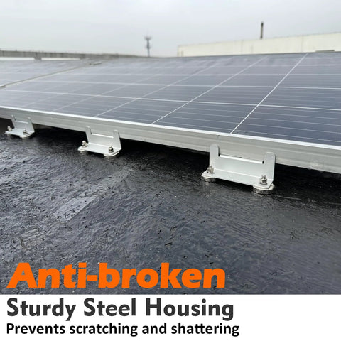 Solar panel mounted on a rooftop using metal clamps and screws.