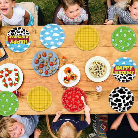 Legendary 7 Inch Cartoon Story Paper Plates 60 Pack Boy Birthday Party Supplies Sky Blue Cow Print Cloud Dessert Dishes on table.