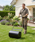 Heavy Duty 23 Inch Lawn Roller With 13 Gallon Water Or Sand Fill Push And Tow Behind Yard Roller in use by man in garden