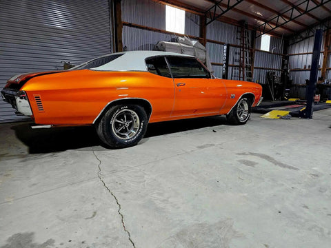 Showroom Smooth Dreamsicle Orange Basecoat Paint Gallon Ready To Spray Mix With Slow Reducer For Zero Hassle Street Car Restorations And Bumper To Bumper Shine on classic orange muscle car in workshop.