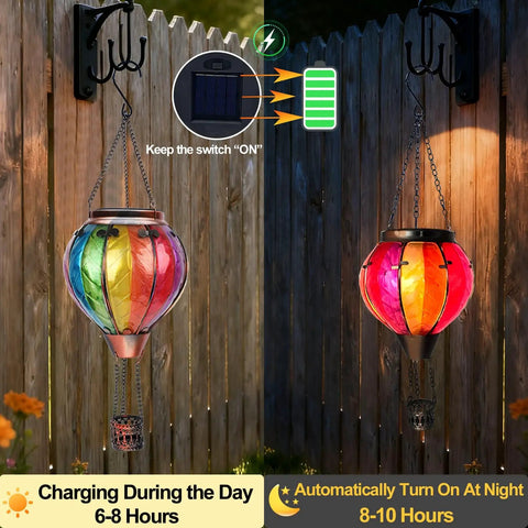 Two Pack Hot Air Balloon Solar Lanterns With Metal Shepherds Hook For Outdoor Pathway Lighting Garden Decor And Cozy Flickering Flame Glow That Charges By Day And Shines At Night, showing color change from day to night.