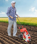 Man using Six Nozzle Hand Push Seeder For Lawn And Garden Walk Behind Roller Planter, 8.27lb capacity in a field