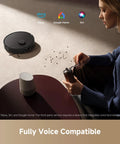 Person using Alexa to control D20 Plus Robot Vacuum And Mop With 13000 Pa Suction Self Emptying 5L Dust Bag DuoBrush on carpet