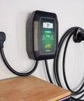 Level 2 Wall Mounted EV Charger With 40 Amp Fast Charging And 25 Foot Flexible Cable NEMA 14 50 Plug on wall with charging cable.