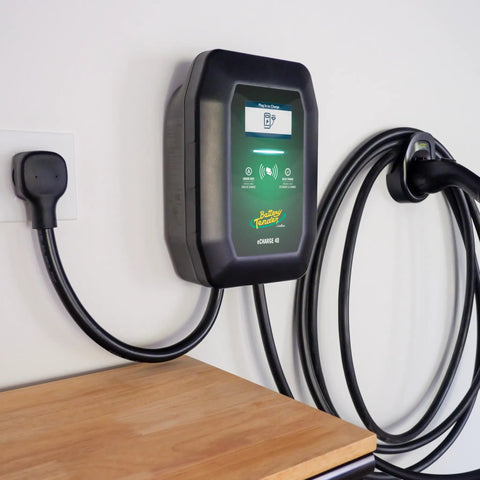 Level 2 Wall Mounted EV Charger With 40 Amp Fast Charging And 25 Foot Flexible Cable NEMA 14 50 Plug on wall with charging cable.
