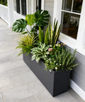 Rectangular Metal Planter Box 36x12x16 Matte Black With Insert Shelf, Drainage Holes And Bottom Water Collection Tray on a patio