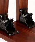 Built Like A Tank Black Foldable Furniture Brackets Self Locking Hinges on wooden surface showing heavy duty steel design and function.
