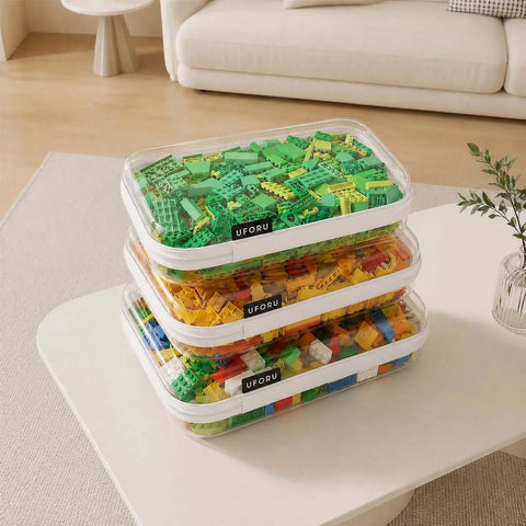 Ridiculously Tough Clear Hard Shell Zipper Cases Including Three Diaper Bag Organizer Pouches stacked with colorful building blocks.