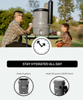 Two people using Five Gallon Portable Sports Cooler And Water Dispenser With Flat Seat Lid Tailgate Ready Insulated Beverage Dispenser