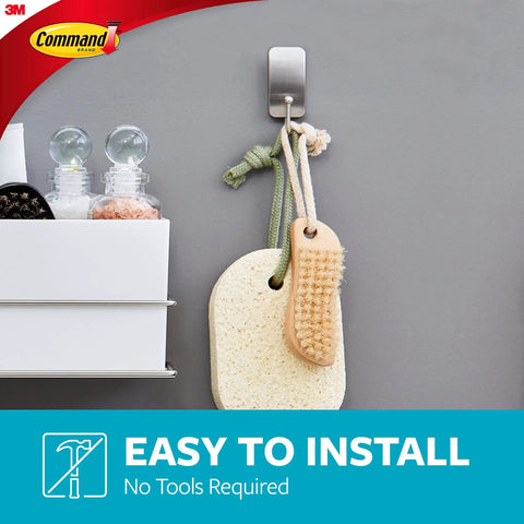 Satin Nickel Bath Hooks 4 Pack With Water Resistant Strips holding a brush and sponge in a bathroom setting.