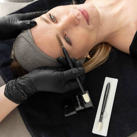 Person wearing Powder Free Nitrile Gloves 12 Inch Pro Grade Extra Durable Black Disposable Latex Free For Hair Dye Cleaning Tattoo Treatments And General Grooming Ideal For Salon And Home Use, applying makeup.