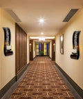 Upgrade Your Vibe With These Badass Antique Bronze Wall Sconces Featuring Openwork Glass Shade Tealight Holders in modern hallway.