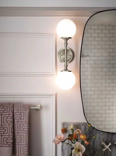 Bathroom with Colinet Traditional 24-Inch Towel Bar in Brushed Nickel, wall light fixtures, and mirror