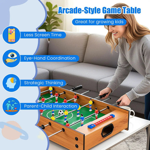 Adult playing on 2 In 1 Swivel Mini Game Table Top Wood Foosball And Slide Hockey Combo in living room setting.