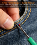 Close-up of a seam ripper from the sewing machine cleaning kit in use on denim for easy stitch removal.