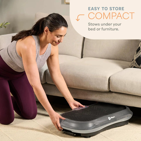 Woman storing Waver Vibration Plate Exercise Machine with High Intensity Full Body Vibration under a sofa.