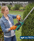 Woman using Pro Grade Cordless Hedge Trimmer With 22 Inch Dual Action Blades Brushless Motor to trim hedge