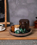 Solid Wood Lazy Susan Set Big Round Serving Tray With Hella Smooth Ball Bearing Turntable Base For Kitchen Counter And Dinner Party Centerpiece Slick Spinning Organizer Easy Setup Stand with coffee and sugar on a wooden table.