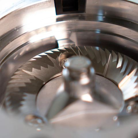 Close-up of stainless steel burrs inside Heavy Duty 64Mm Flat Burr Electric Coffee Grinder Designed For Single Dosing Habits.