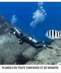 Divers underwater with Descent G2 Watch Style Dive Computer With Bright AMOLED Display And Sapphire Lens, fish nearby.