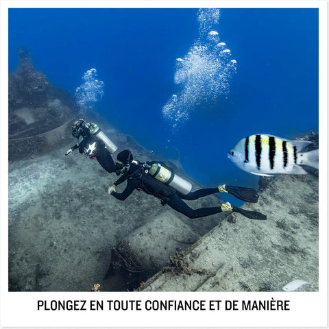 Divers underwater with Descent G2 Watch Style Dive Computer With Bright AMOLED Display And Sapphire Lens, fish nearby.